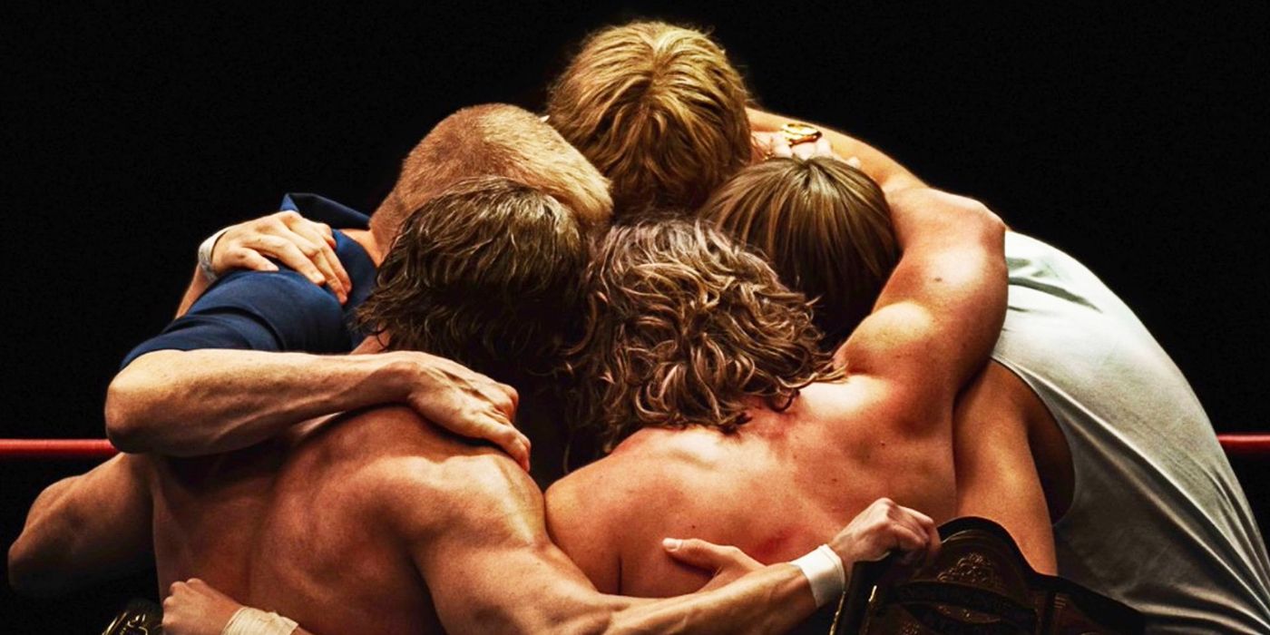 Fritz, Kevin, Kerry, David, and Michael Von Erich embrace in the center of the ring in a scene from The Iron Claw.